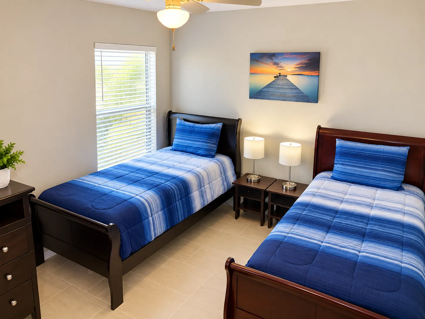 Resident twin bedroom with blue striped bedding